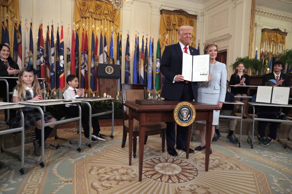 U.S. President Donald Trump stands with Secretary of Education Linda McMahon after signing an executive order to reduce the size and scope of the Education Department during a ceremony in the East Room of the White House on March 20, 2025 in Washington, D.C. The order instructs McMahon to shrink the department, which cannot be dissolved without congressional approval. (Photo by Chip Somodevilla/Getty Images)