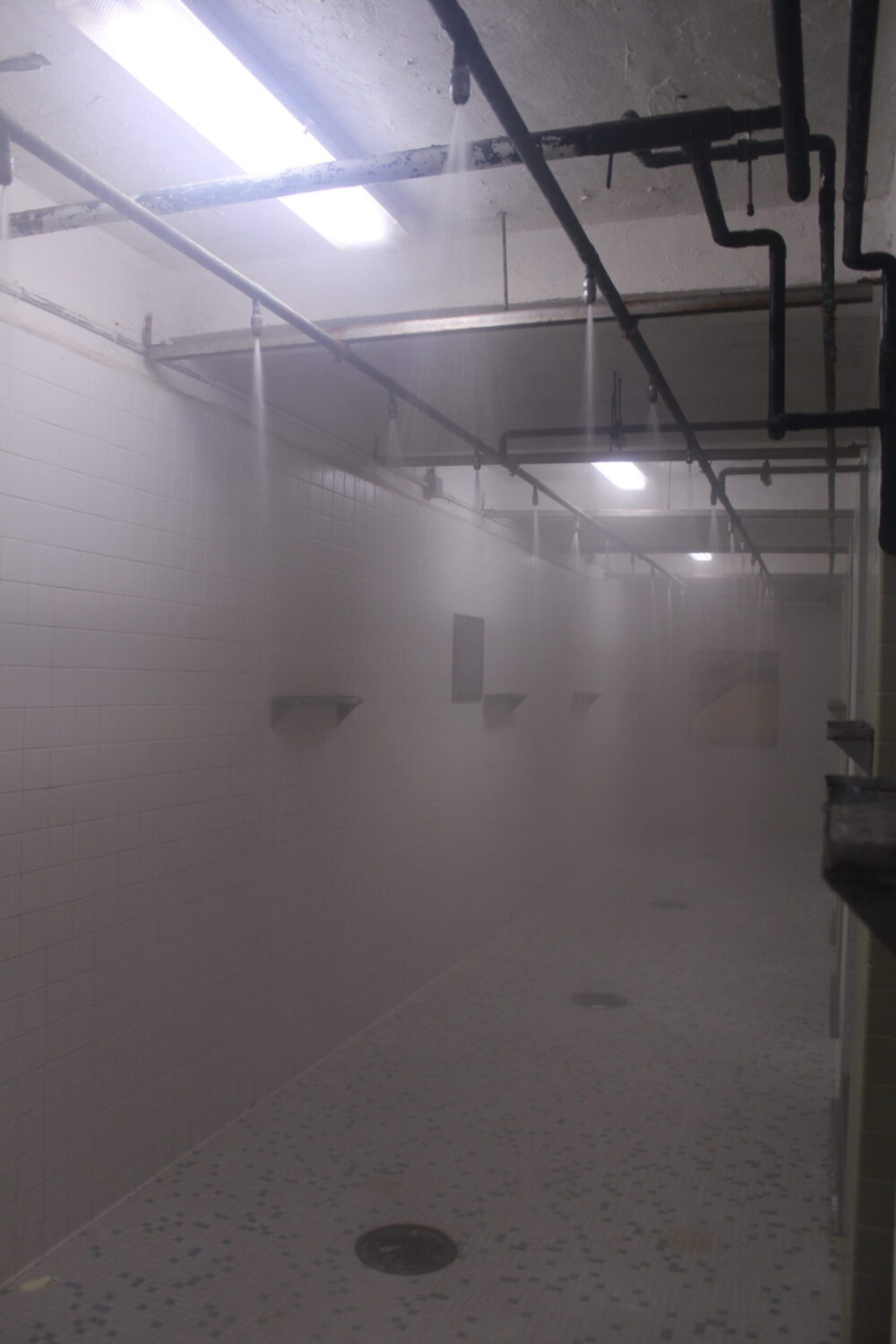 Steam from a communal shower at the South Dakota State Penitentiary. (Courtesy of South Dakota Department of Corrections)