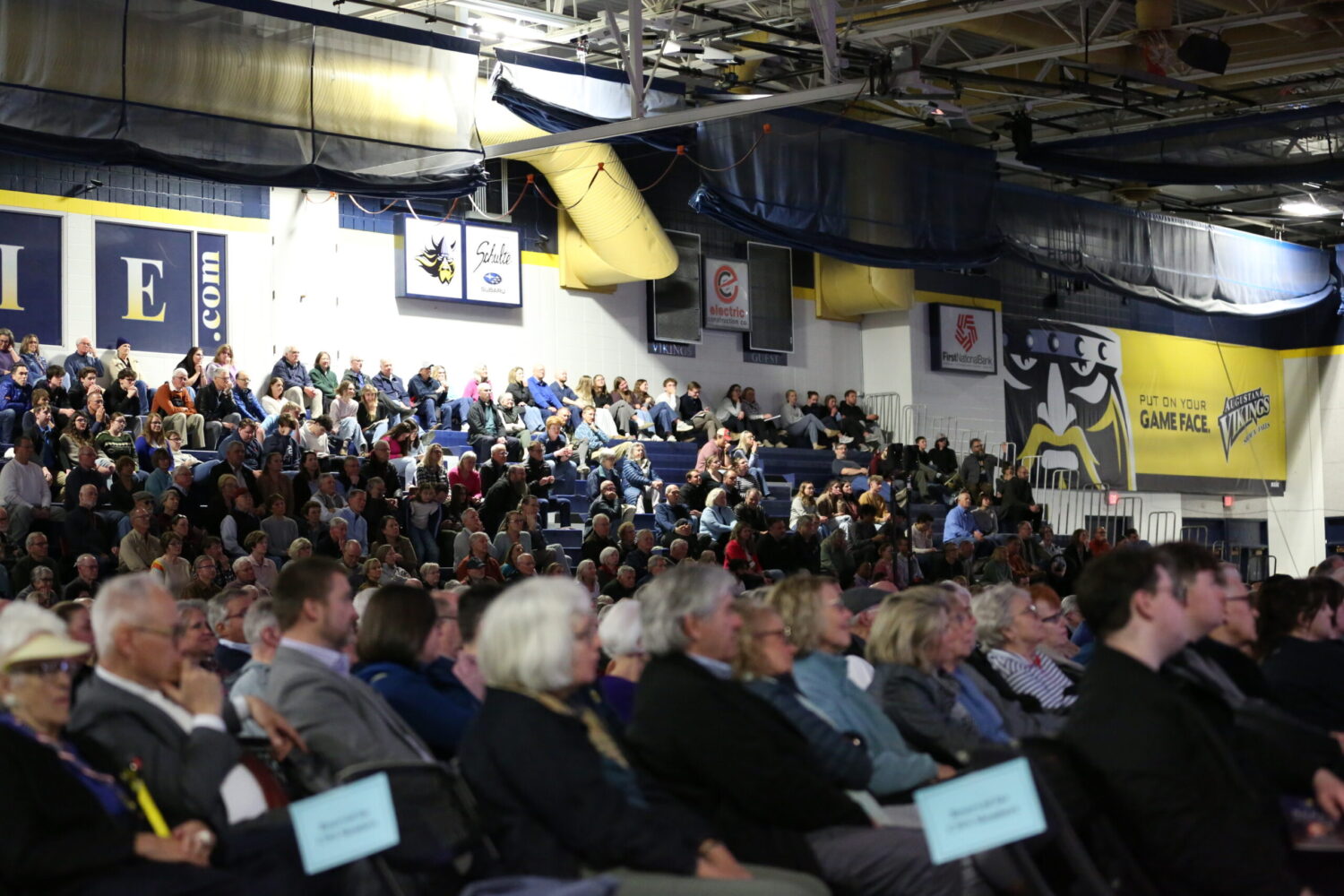 An audience listens as former NATO Supreme Allied Commander James Stavridis speaks at Augustana University in Sioux Falls on March 26, 2026. (Photo by Joshua Haiar/South Dakota Searchlight)