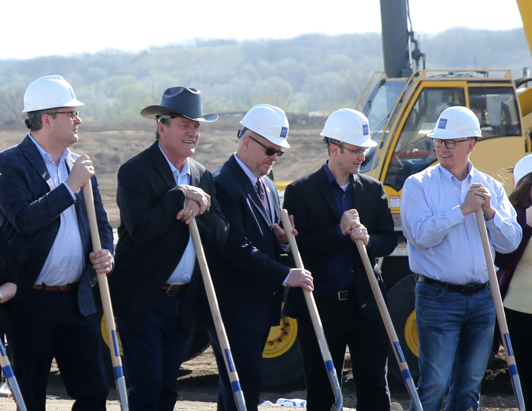 From left, Lt. Gov. Tony Venhuizen, Gov. Larry Rhoden, Corrections Secretary Nick Lamb, Senior Policy Adviser and Director of Legislative Relations Ryan Brunner of the governor's office, and Department of Corrections Facilities Manager Darwin Weeldreyer participate in a groundbreaking for a men's prison in Sioux Falls on April 22, 2026. (Photo by John Hult/South Dakota Searchlight)