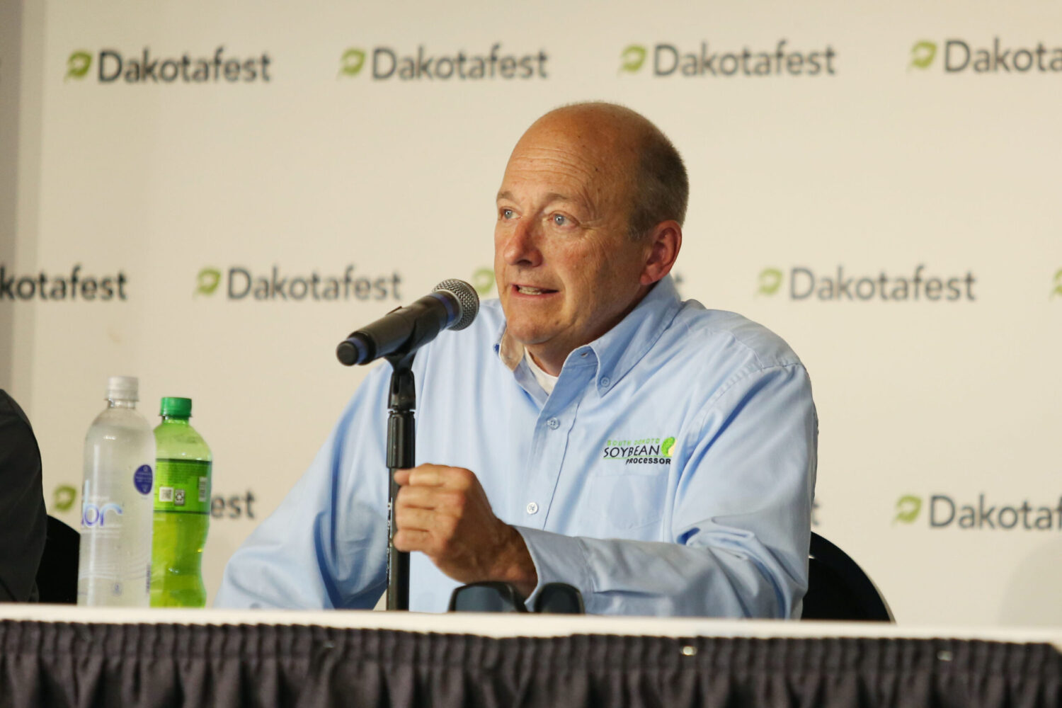 South Dakota Soybean Processors CEO Tom Kersting speaks during a presentation about High Plains Processing during a panel discussion at Dakotafest in Mitchell on Aug. 20, 2025. (Makenzie Huber/South Dakota Searchlight)