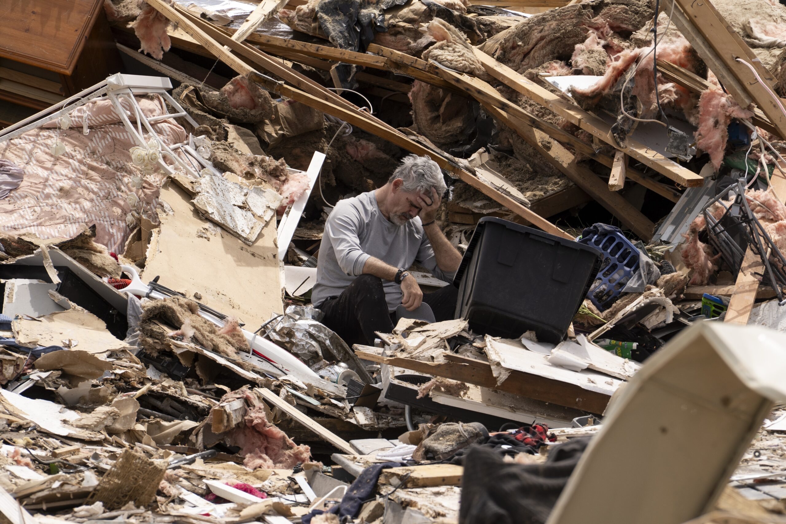 James Sexton is overcome by emotions while cleaning up the debris of his house on May 18, 2025 in the community of Sunshine Hills outside of London, Kentucky. A tornado struck the neighborhood just after midnight on May 17, 2025. (Photo by Michael Swensen/Getty Images)
