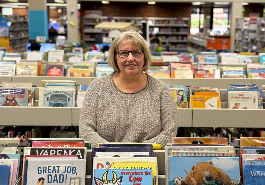 Jodi Fick stands in the children's section of Siouxland Libraries' downtown Sioux Falls location. (Joshua Haiar/South Dakota Searchlight)
