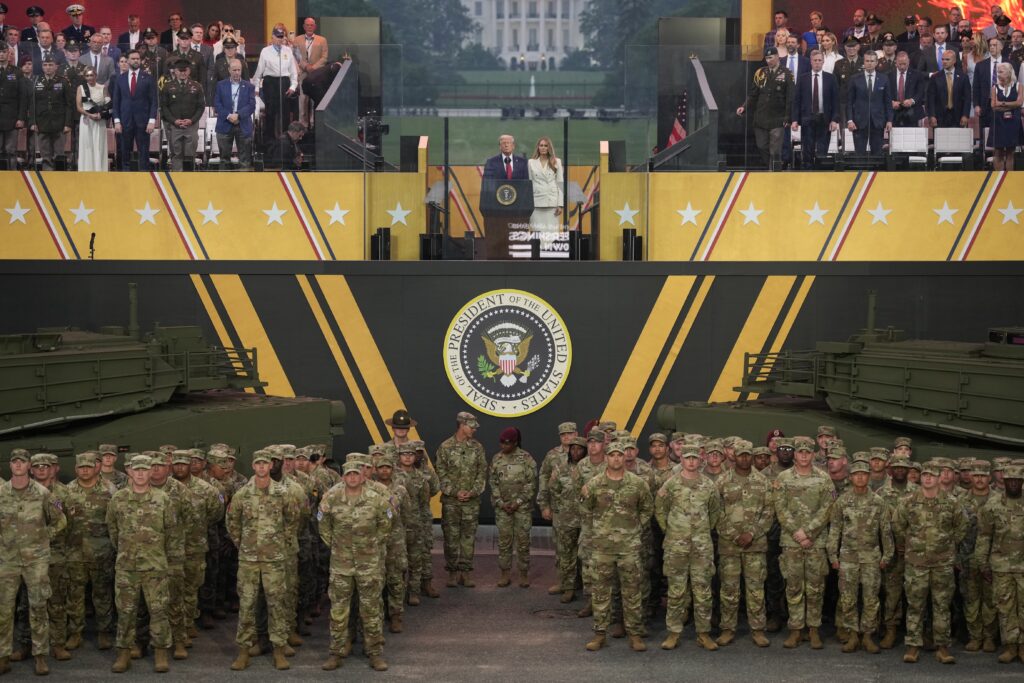U.S. President Donald Trump and first lady Melania Trump stand together at the end of the U.S Army parade on June 14, 2025 in Washington, D.C. (Photo by Andrew Harnik/Getty Images)