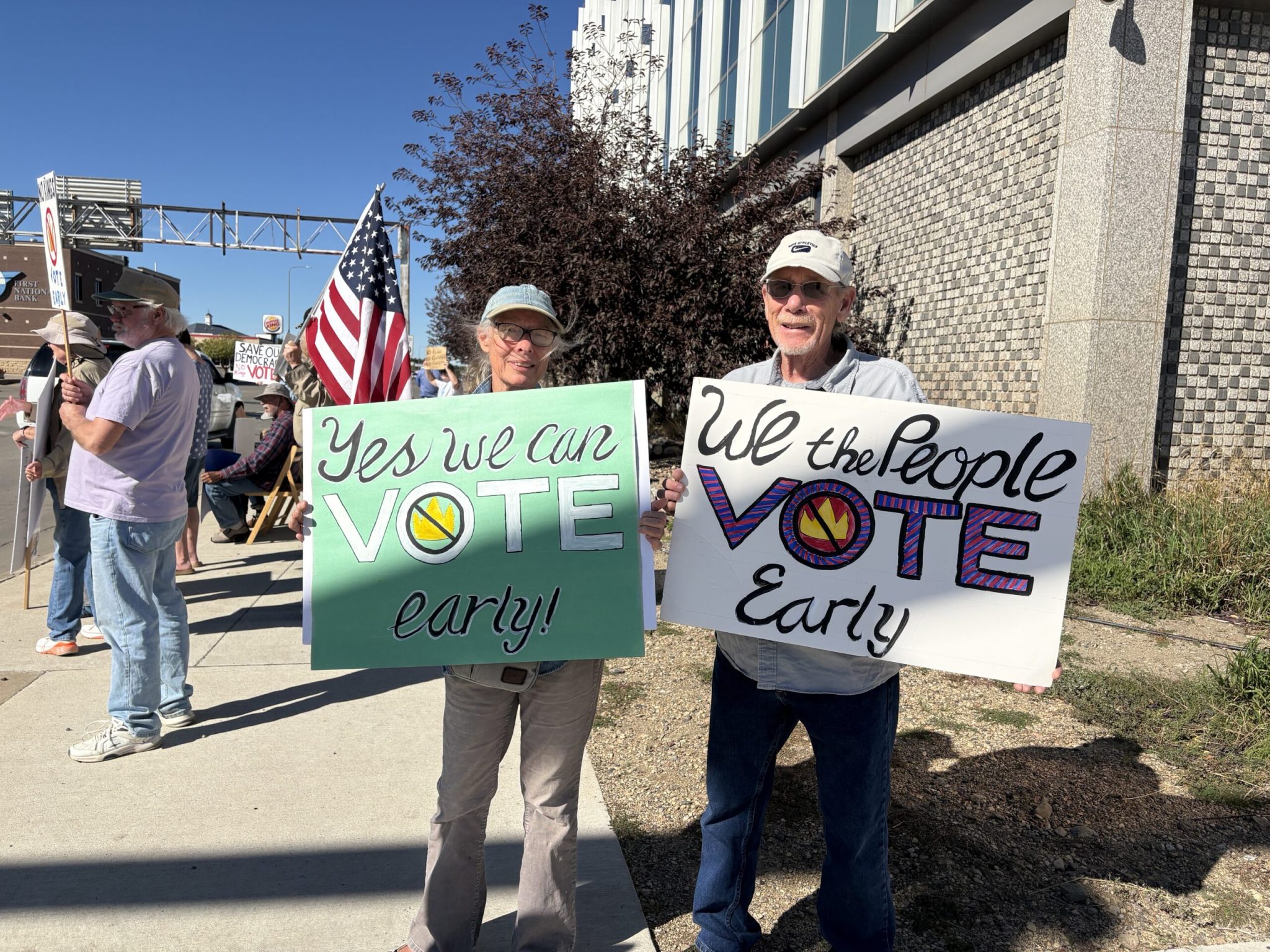 Constance Hoffman, left, and Michael Elsasser traveled from Winner, South Dakota, to support the early voting message at the No Kings rally in Pierre on Oct. 17, 2026. (Photo by Meghan O'Brien/South Dakota Searchlight)