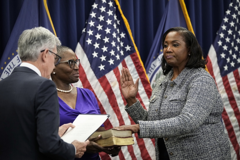 Federal Reserve Chair Jerome Powell administers the oath of office to Lisa Cook to serve as a member of the Board of Governors at the Federal Reserve System during a ceremony at the William McChesney Martin Jr. Building of the Federal Reserve May 23, 2022, in Washington, D.C. (Photo by Drew Angerer/Getty Images)