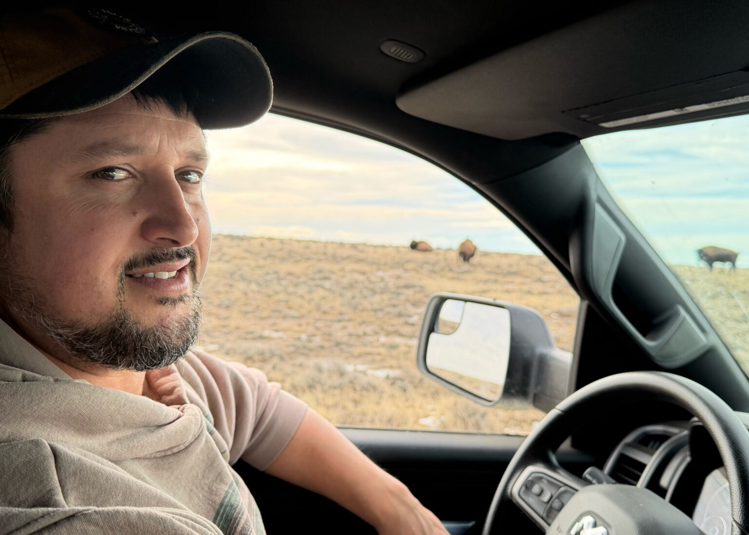 Scott Heidebrink, director of landscape stewardship for American Prairie, drives his truck around the foundation’s land. (Credit: Blaine Harden/Inside Climate News)