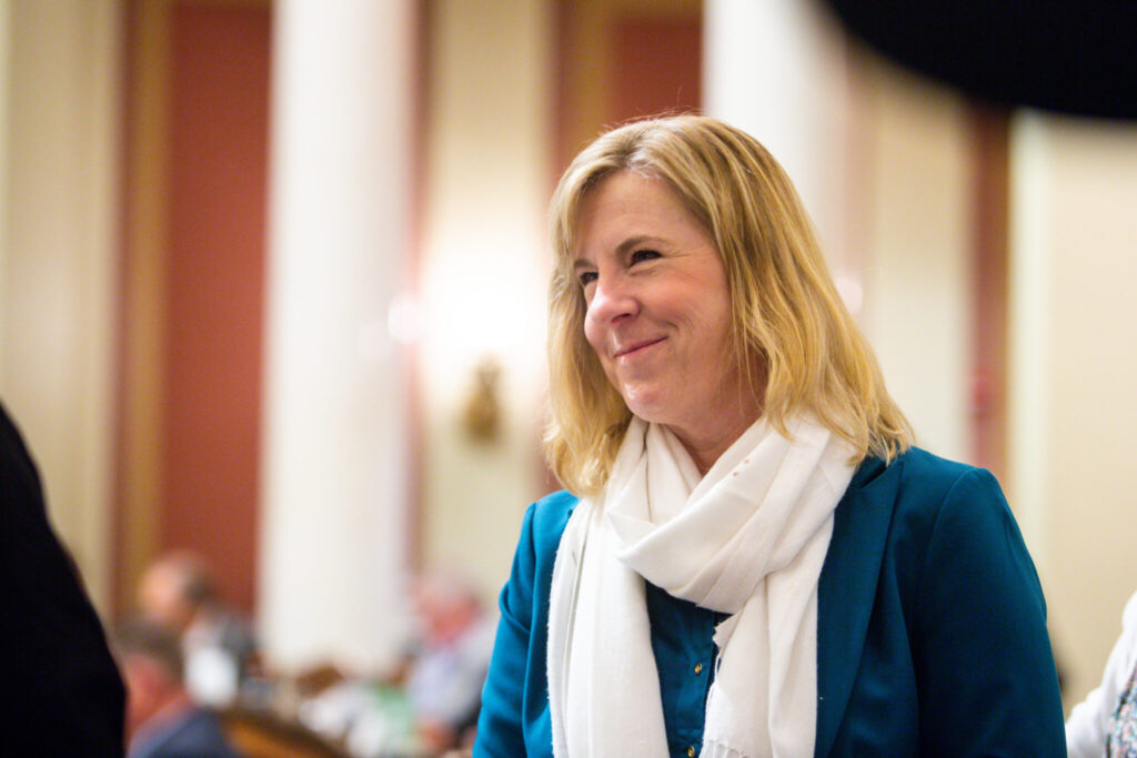 Speaker emeritus Rep. Melissa Hortman talks to colleagues during a special legislative session June 9, 2025, at the Minnesota State Capitol in St. Paul. (Photo by Nicole Neri/Minnesota Reformer)