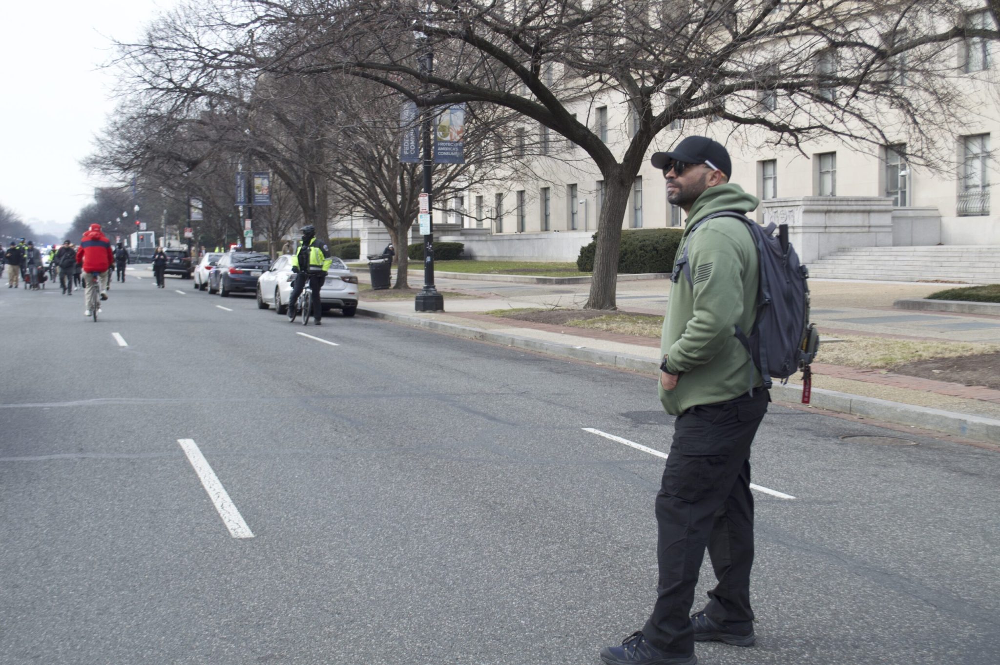 Former national Proud Boys leader Enrique Tarrio looked on as far-right activists celebrating the Jan. 6 Capitol attack marched down Constitution Avenue on Tuesday, Jan. 6, 2026. Tarrio was sentenced to 22 years in prison on sedition charges related to the attack, but President Donald Trump commuted his sentence in January. (Photo by Ashley Murray/States Newsroom)