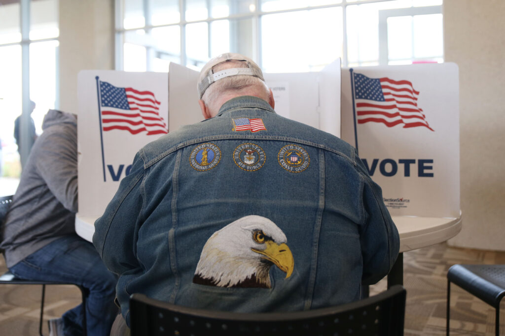 A Sioux Falls resident votes in the 2024 general election on Nov. 5 at Gloria Dei Lutheran Church. (Makenzie Huber/South Dakota Searchlight)
