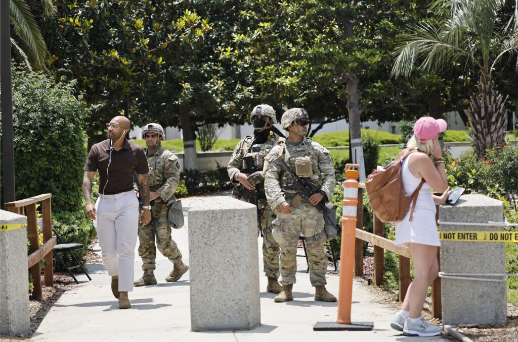 California National Guard members stand guard at an entrance to the Wilshire Federal Building on June 13, 2025 in Los Angeles, California. (Photo by Mario Tama/Getty Images)