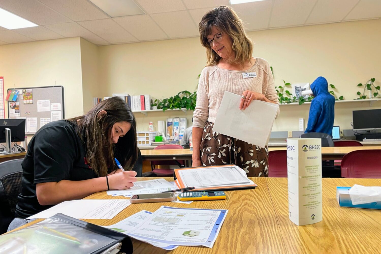 Stephenie Rittberger, adult education program manager, helps Erica Anderson with math on July 17, 2025, at the Career Learning Center of the Black Hills in Rapid City. (Seth Tupper/South Dakota Searchlight)