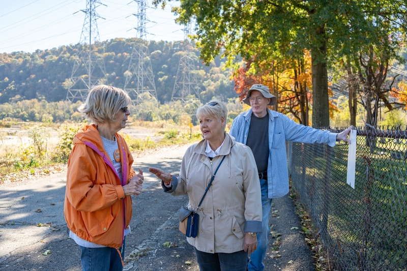 Lifelong Springdale, Pennsylvania, residents Vicki Wanamaker, Cathy Mager and Marty Garrigan stand at the fenced-off St. Mark's Cemetery on Monday. Oct. 19, 2026, adjacent to a proposed 47-acre data center facility in their community. (Photo by Ashley Murray/States Newsroom)