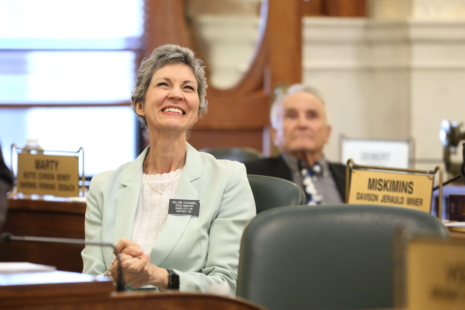 State Sen. Helene Duhamel, R-Rapid City, claps and welcomes students to the Senate gallery in Pierre on Feb. 10, 2026. (Photo by Makenzie Huber/South Dakota Searchlight)