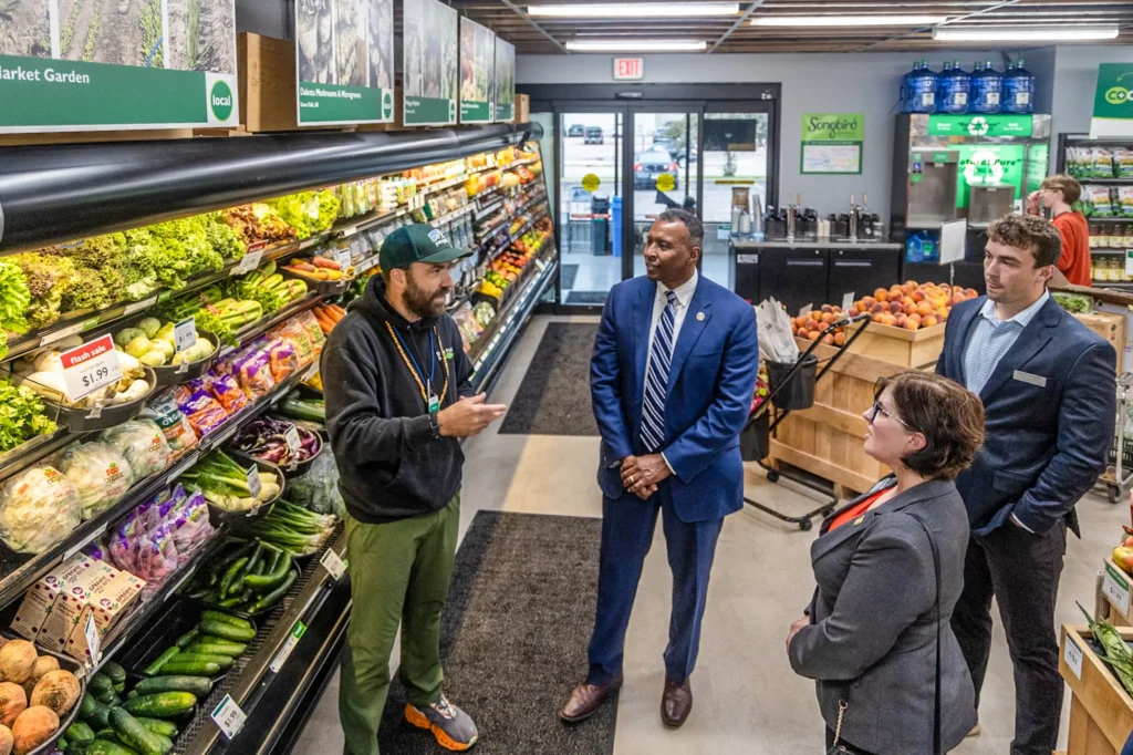 Former USDA Under Secretary for Rural Development Basil Gooden, center, visits a grocery store that's supported by federal dollars on Aug. 29, 2024, in Sioux Falls. (Preston Keres/USDA)