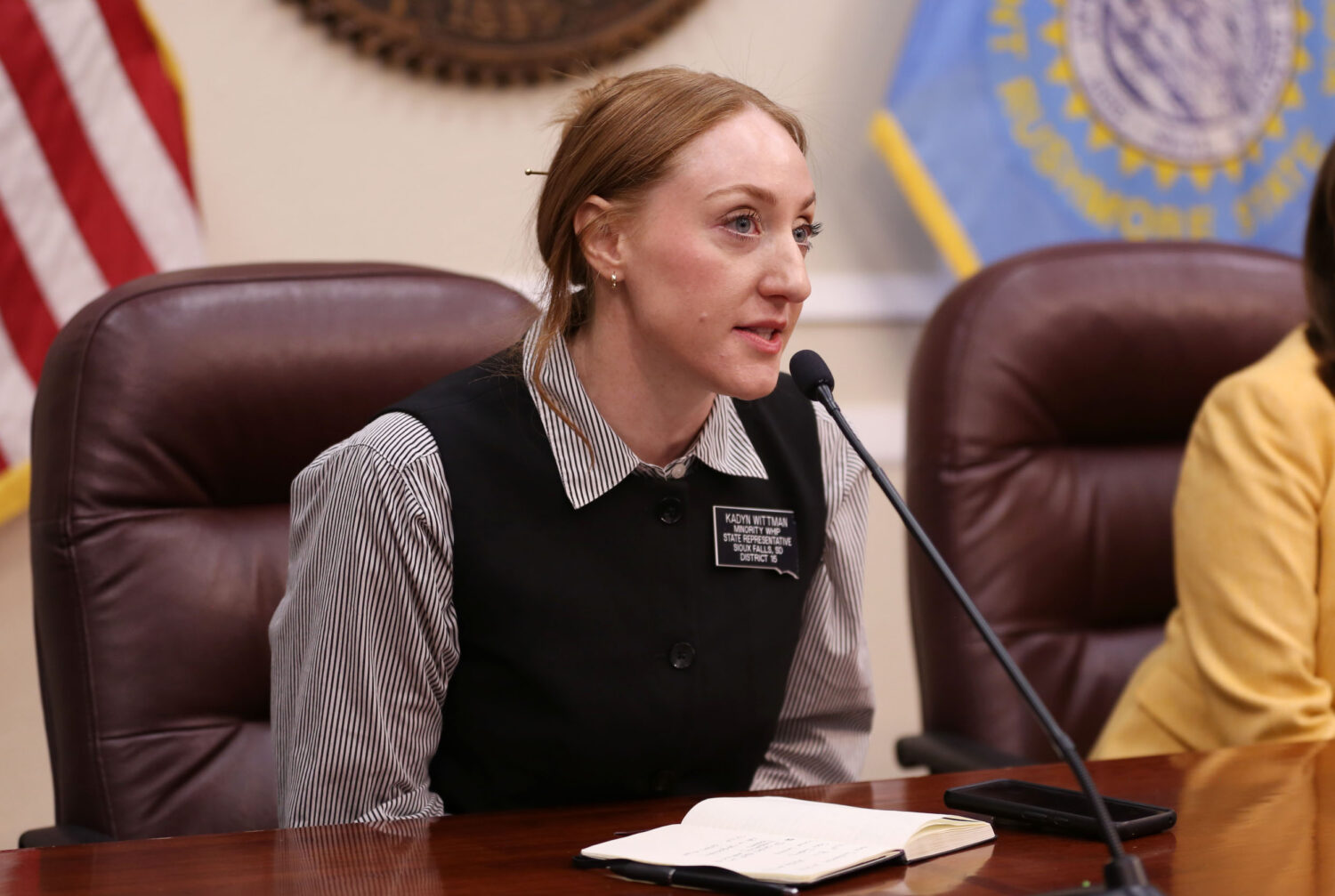 State Rep. Kadyn Wittman, D-Sioux Falls, speaks to members of the media at the Capitol in Pierre on Feb. 12, 2026. (Photo by Makenzie Huber/South Dakota Searchlight)
