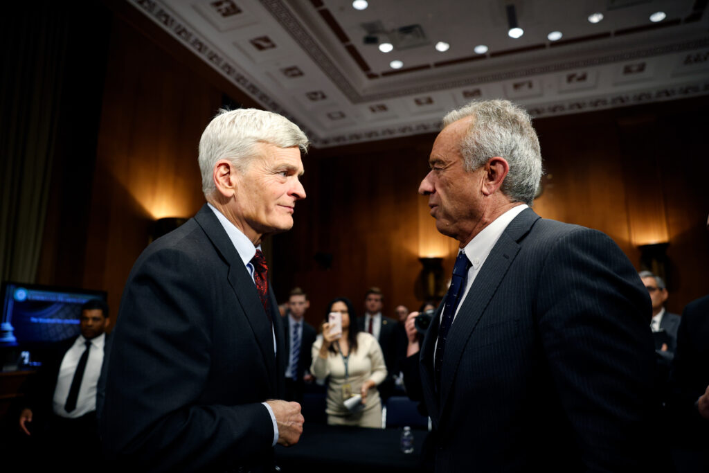 U.S. Senate Health, Education, Labor and Pensions Chairman Bill Cassidy speaks with Health and Human Services Secretary Robert F. Kennedy Jr. after Kennedy's confirmation hearing on Jan. 30, 2025. (Photo by Kevin Dietsch/Getty Images)