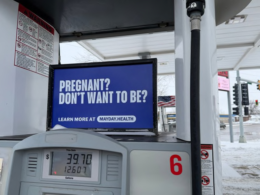 Mayday Health posted signs like this one at gas stations around South Dakota in December 2025 as part of a campaign to spread awareness about the availability of abortion pills. (Courtesy of Mayday Health)