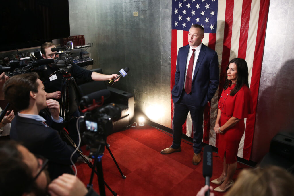 State Reps. Jon Hansen, R-Dell Rapids, and Karla Lems, R-Canton, speak to the press after they announced their campaign for governor and lieutenant governor at an event in Sioux Falls on April 24, 2025, at the Military Heritage Alliance. (Makenzie Huber/South Dakota Searchlight)