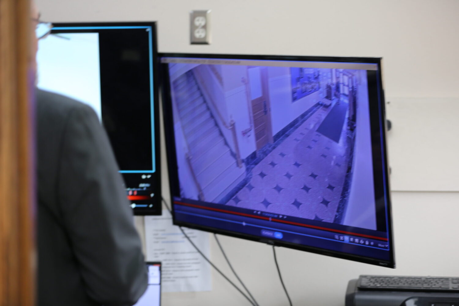 An officer reviews security footage in Pierre on Feb. 24, 2026, searching for Sen. John Carley, a Republican from Piedmont. (Photo by Joshua Haiar/South Dakota Searchlight)
