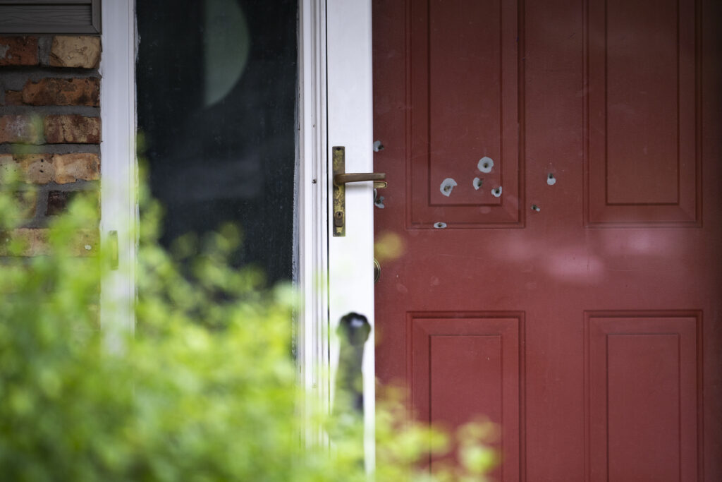 Bullet holes are seen in the door outside the home of state Sen. John Hoffman on June 15, 2025, in Champlin, Minnesota. Hoffman and his wife were shot and hospitalized on June 14. DFL State Rep. Melissa Hortman and her husband, Mark Hortman, were also shot and killed. (Stephen Maturen/Getty Images)