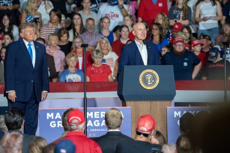 U.S. Sen. Pete Ricketts of Nebraska praises President Donald Trump during a midterms rally in Grand Island, Nebraska, that Trump headlined on Oct. 5, 2026, at the Nebraska State Fairgrounds with thousands in attendance. (Photo by Zach Wendling/Nebraska Examiner)
