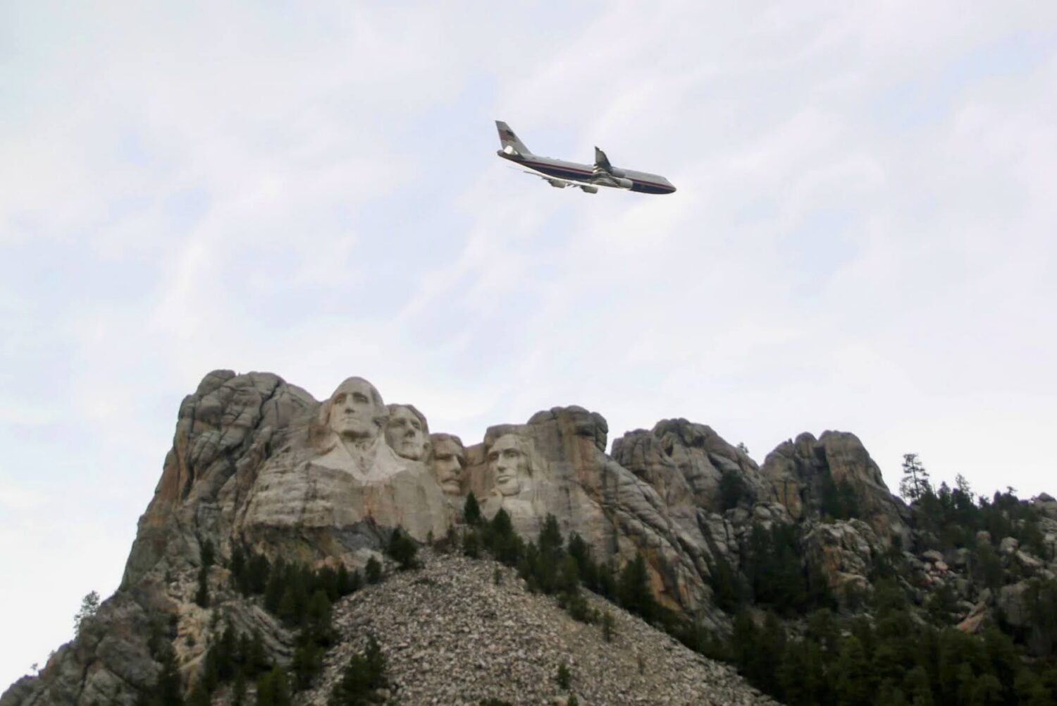 Air Force One flies over Mount Rushmore National Memorial in western South Dakota on July 3, 2026, before a fireworks display attended by President Donald Trump. (Photo by Meghan O'Brien/South Dakota Searchlight)