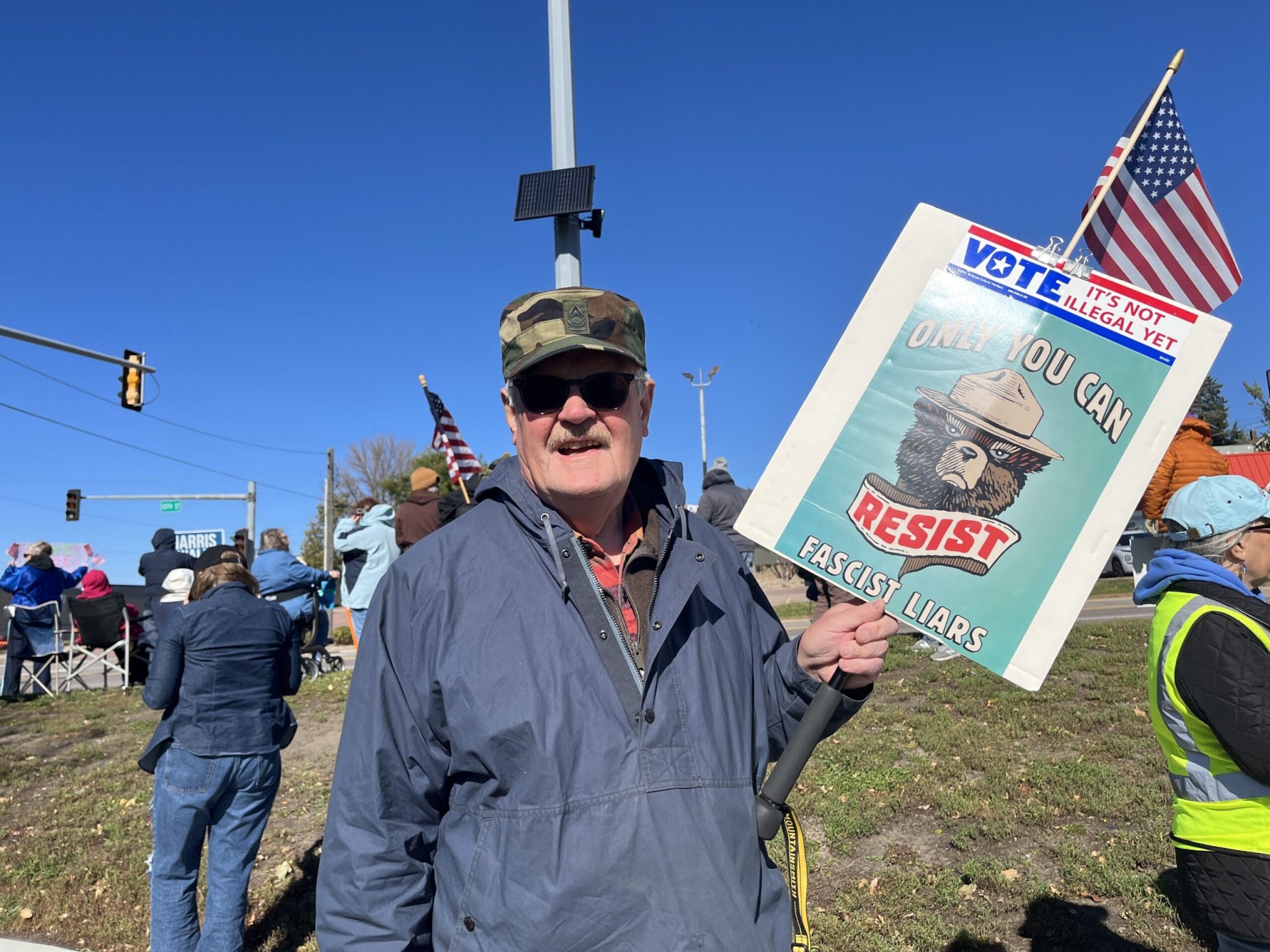 Seventy-seven-year-old Sioux Falls resident Chuck Larson said he’s attended every No Kings demonstration in the city because President Donald Trump “has messed up everything he’s touched.” Larson said he voted early for the general election at the Minnehaha County Auditor’s Office. (Photo by Makenzie Huber/South Dakota Searchlight)