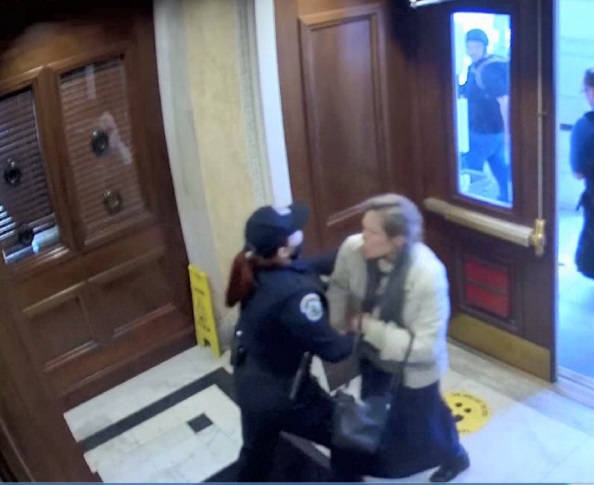 According to prosecutors, this image shows Sioux Falls resident Amy Willis and a police officer in Washington, D.C., on Jan. 6, 2021. Willis is criminally charged for her alleged participation in the Capitol riot. (Courtesy of U.S. Department of Justice)