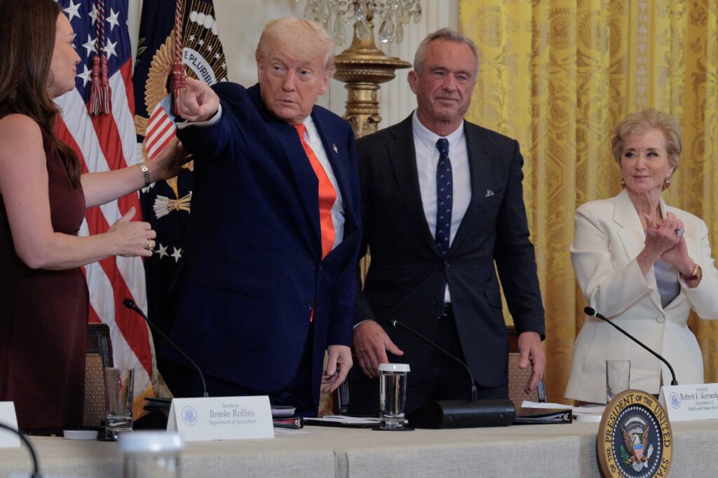 President Donald Trump points during a White House event for the release of Make America Healthy Again commission report on May 22, 2025. Also pictured are, from left, Agriculture Secretary Brooke Rollins, Health and Human Services Secretary Robert F. Kennedy Jr. and Education Secretary Linda McMahon. (Photo by Chip Somodevilla/Getty Images)