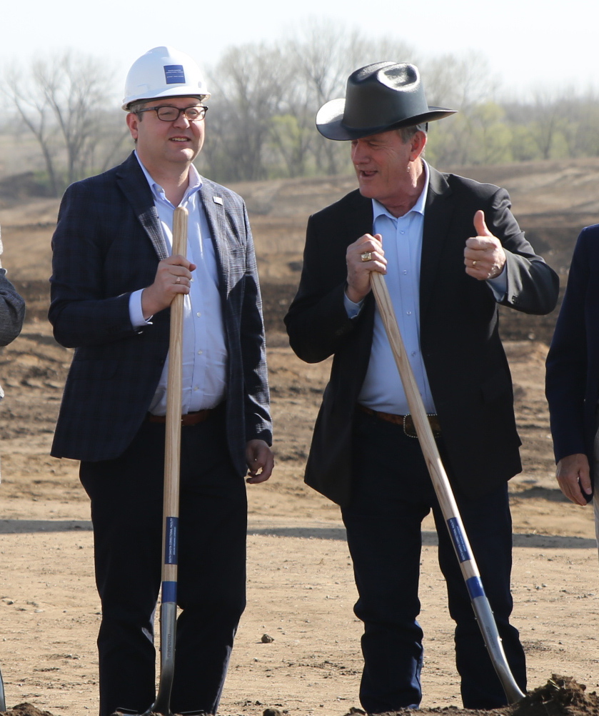 South Dakota Gov. Larry Rhoden, right, standing next to Lt. Gov. Tony Venhuizen, gives a thumbs-up gesture prior to the groundbreaking for a men's prison in Sioux Falls on April 22, 2026. (Photo by John Hult/South Dakota Searchlight)
