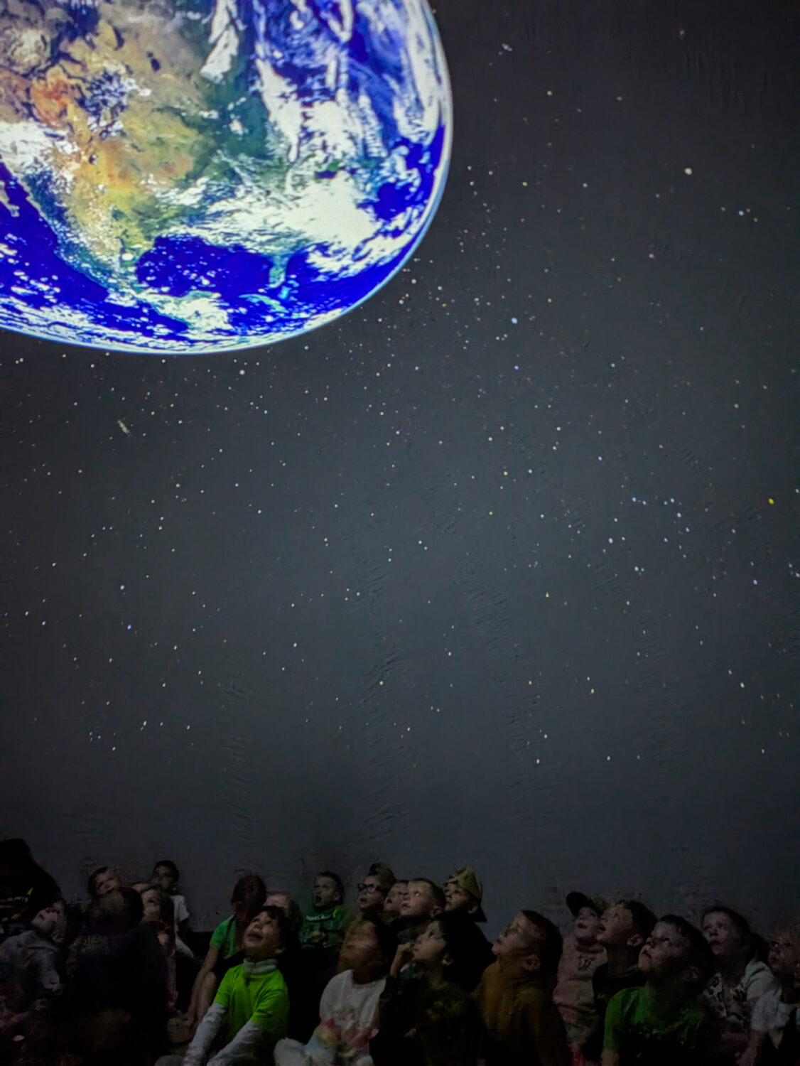 During the planetarium’s daylong visit to the small community of Hayti, an educator from the South Dakota Discovery Center wowed 500 elementary school students with a presentation about the planets and stars. (Anya Kamenetz for The Hechinger Report)