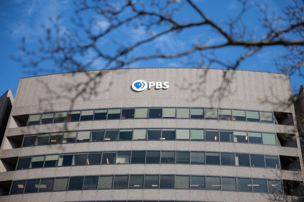 A sign for the Public Broadcasting Service is seen on its building headquarters on Feb. 18, 2025 in Arlington, Virginia. (Photo by Kayla Bartkowski/Getty Images)