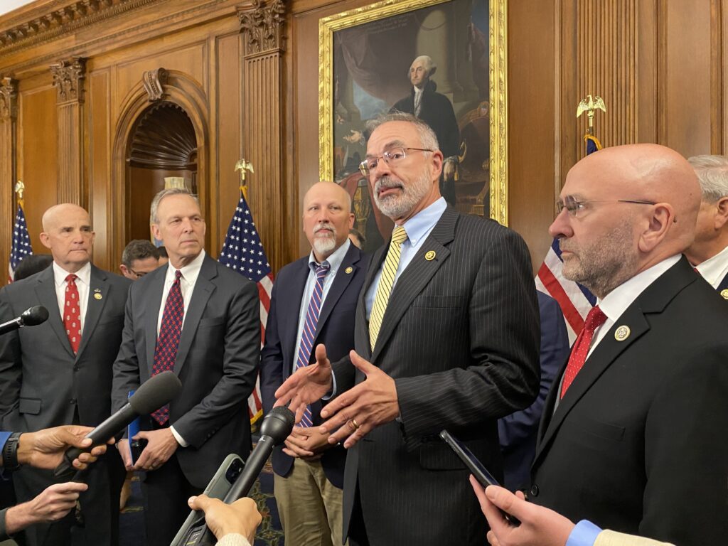 U.S. House Freedom Caucus Chair Andy Harris, R-Md., center, speaks to reporters on Wednesday, May 21, 2025 at the U.S. Capitol. From left are Republicans Keith Self of Texas, Scott Perry of Pennsylvania and Chip Roy of Texas. (Photo by Jennifer Shutt/States Newsroom)