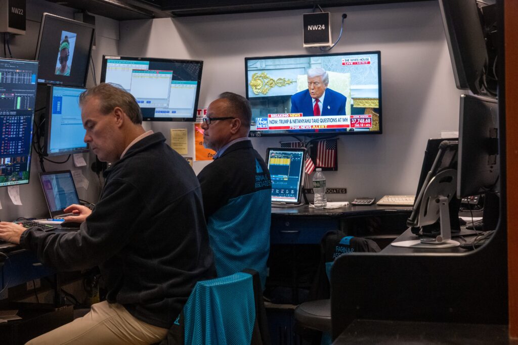 President Donald Trump is displayed on a television screen as traders work on the floor of the New York Stock Exchange on April 7, 2025 in New York City. Markets around the world fell dramatically as global leaders, businesses and economies tried to understand and come to terms with Trump's tariff policy. (Photo by Spencer Platt/Getty Images)