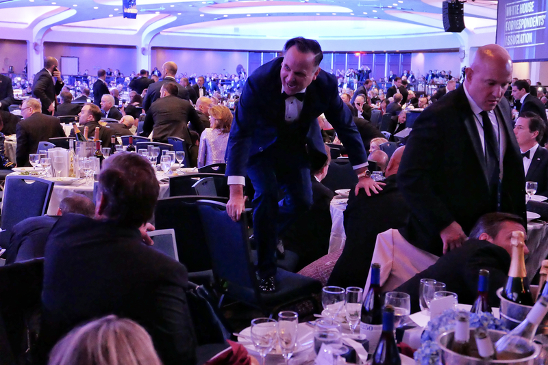 White House Deputy Chief of Staff Dan Scavino jumps over a chair after a shooting incident at the annual White House Correspondents Association Dinner April 25, 2026 in Washington, DC. (Photo by Chip Somodevilla/Getty Images)