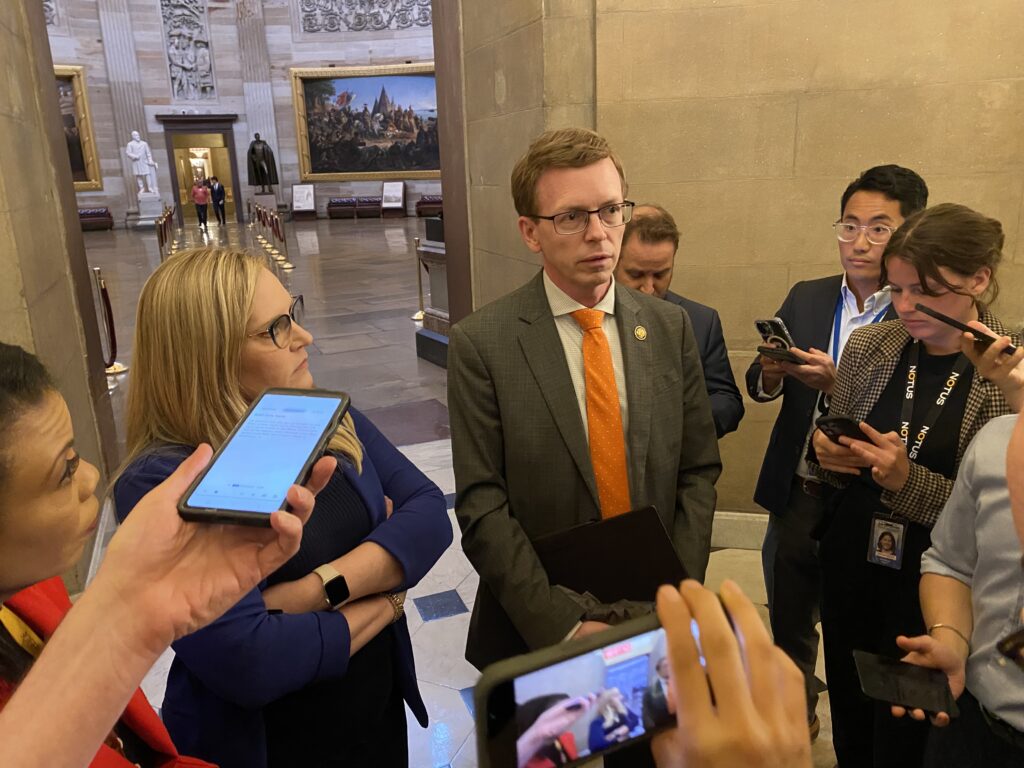 Indiana Rep. Erin Houchin, left, and South Dakota Rep. Dusty Johnson, both Republicans, speak with reporters inside the U.S. Capitol on May 21, 2025. (Jennifer Shutt/States Newsroom)