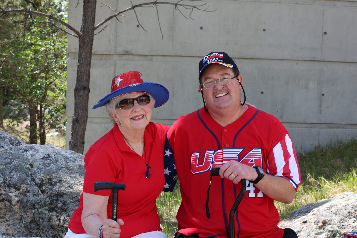 Mary Lou Emerson, 84, and her son, Ron Emerson, both of Willis, Texas, pose for a photo at South Dakota’s Freedom 250 Mount Rushmore Fireworks Celebration on July 3, 2026. (Photo by Meghan O'Brien/South Dakota Searchlight)