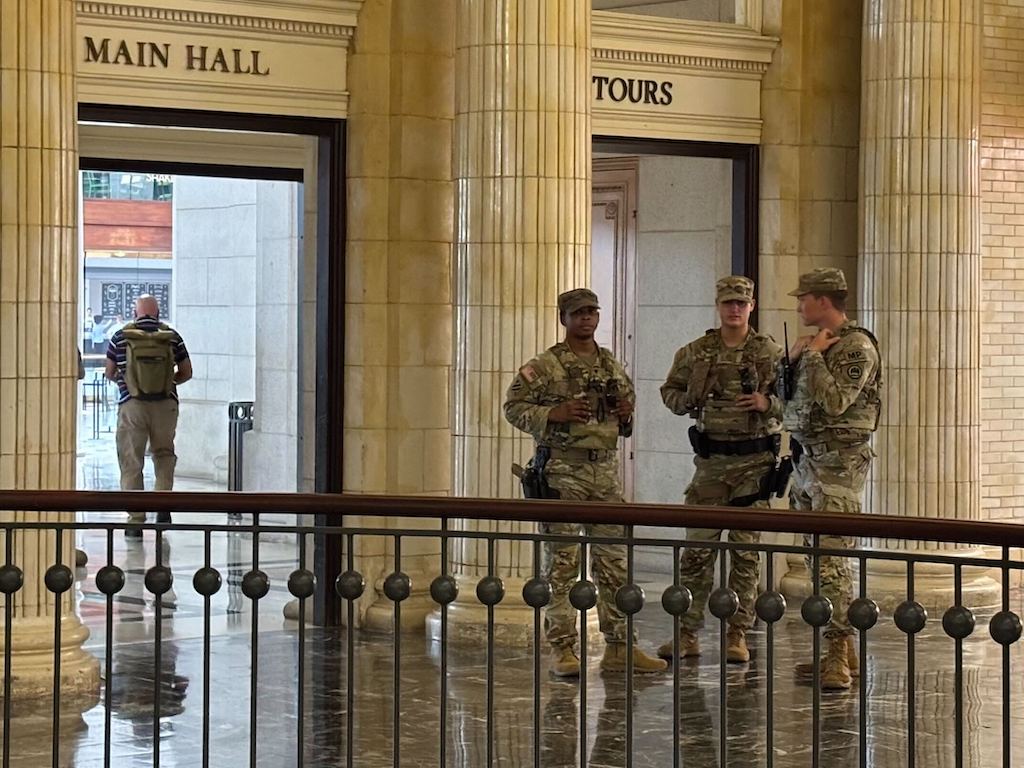 Military personnel patrol inside Union Station in Washington, D.C.