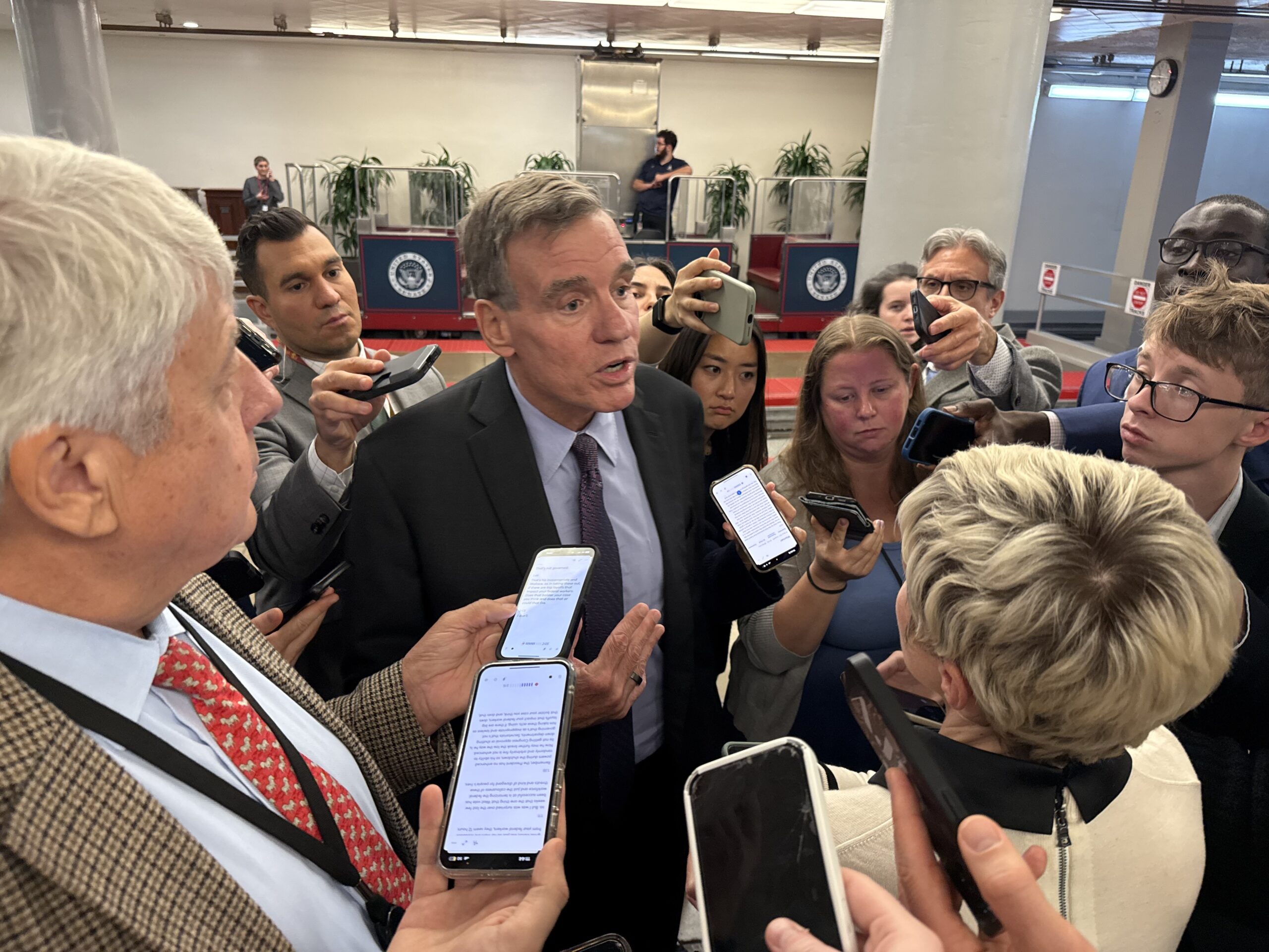 Virginia Sen. Mark Warner speaks with reporters in the U.S. Capitol building on Wednesday, Oct. 1 , 2025. (Photo by Jennifer Shutt/States Newsroom)