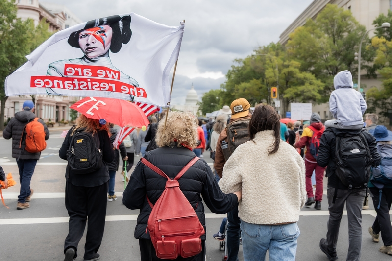 Linda Levine, left, of Washington, D.C., and her daughter, Ari Hershey, walk toward the U.S. Capitol during the Umbrella Walk on No Kings day on Oct. 17, 2026. (Photo by Baya Burgess/ States Newsroom)