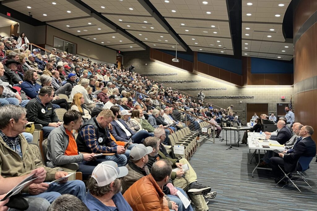 Hundreds of people fill the Southeast Technical College auditorium in Sioux Falls for a Public Utilities Commission hearing about a carbon dioxide pipeline proposal on Jan. 15, 2025. (Makenzie Huber/South Dakota Searchlight)