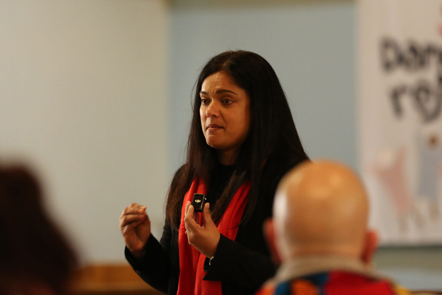 South Dakota Voices for Peace Director Taneeza Islam weeps as she talks at a vigil on Feb. 18, 2026, about people deported from South Dakota. (Photo by John Hult/South Dakota)