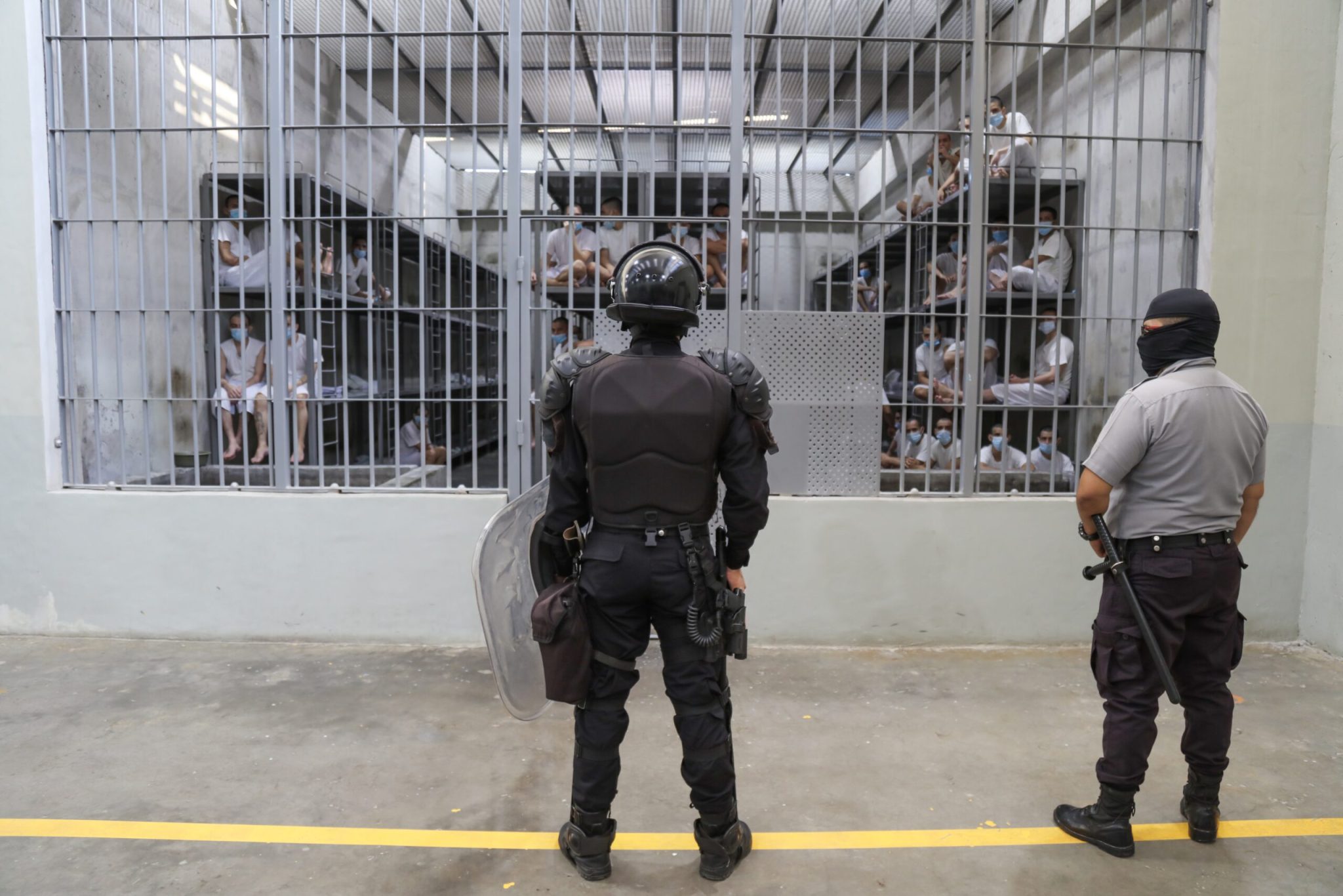 Prison officers stand guard a cell block at maximum security penitentiary CECOT , or Center for the Compulsory Housing of Terrorism, on April 4, 2025 in Tecoluca, San Vicente, El Salvador.  (Photo by Alex Peña/Getty Images)