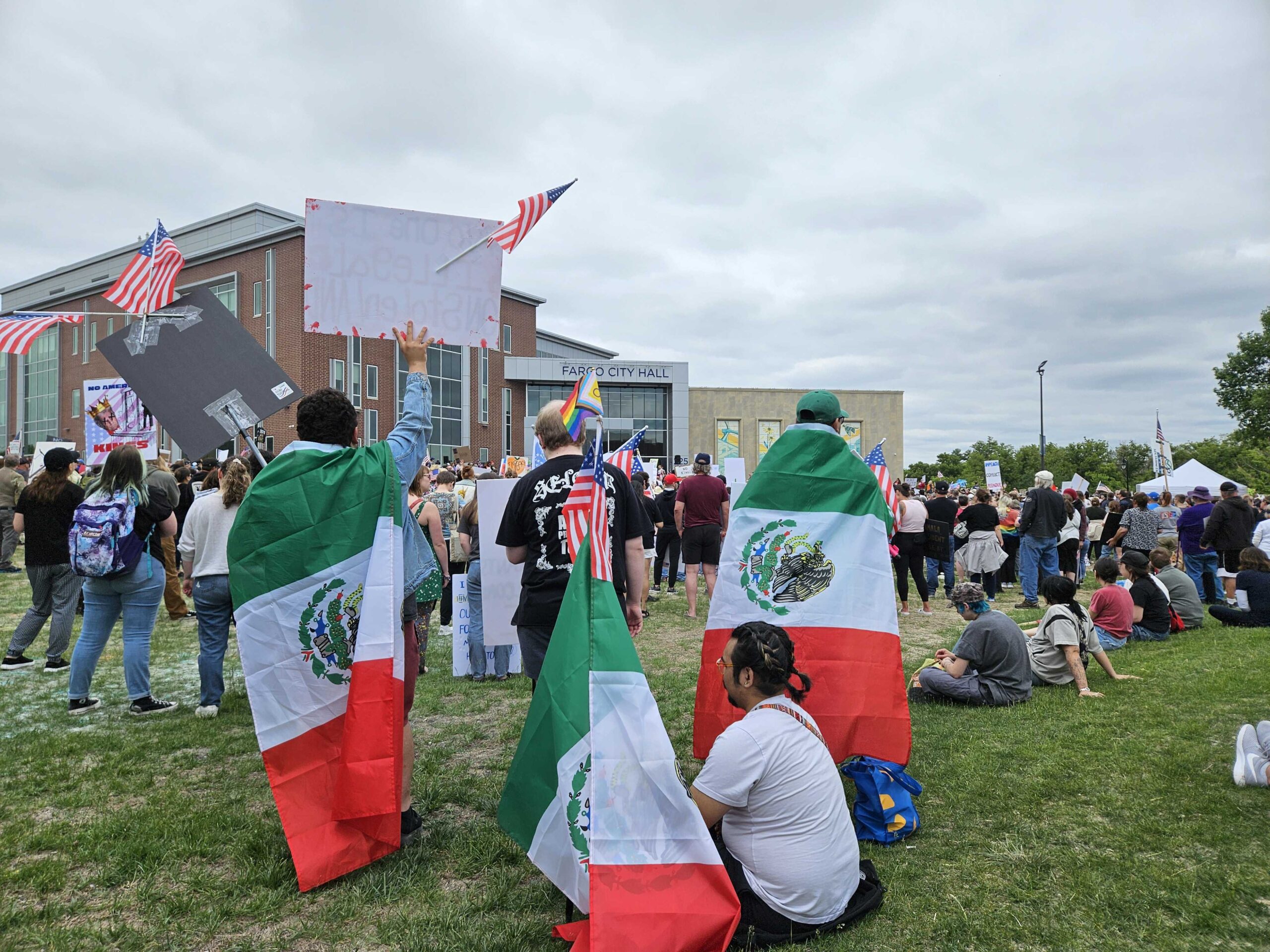 Jacob Pruneda, Fargo, North Dakota, was wrapped in a Mexican flag while attending a No Kings rally June 14, 2025 at Fargo City Hall.